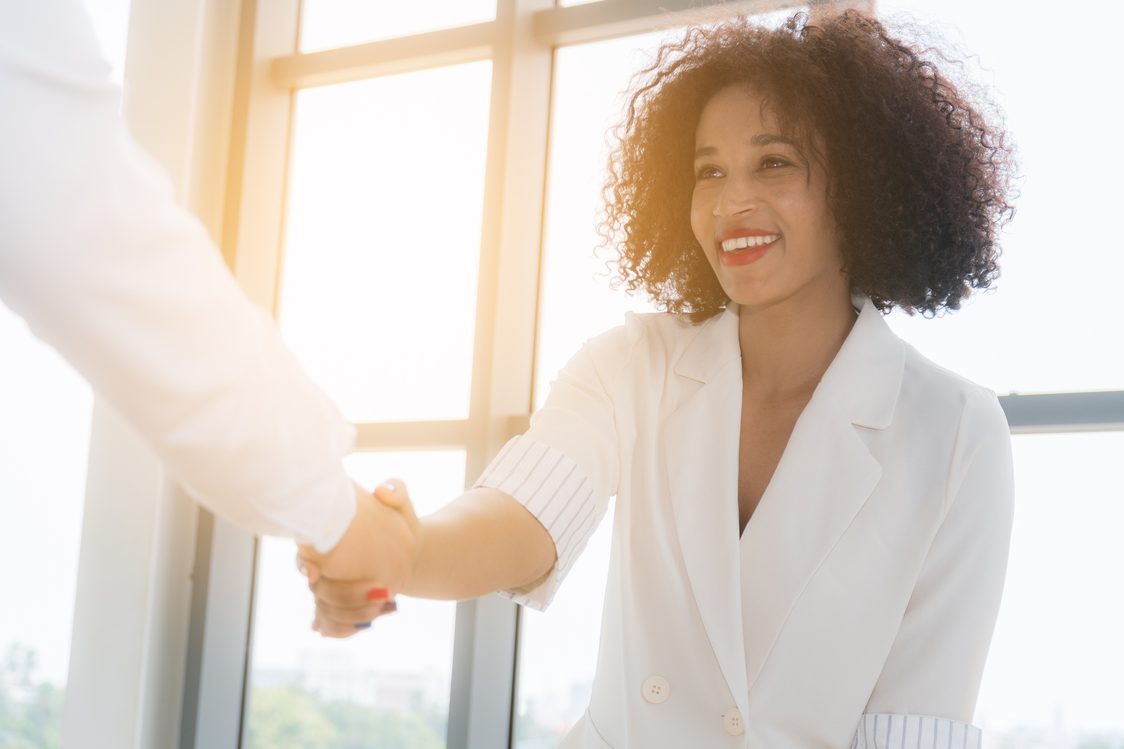 Business woman shaking hand.